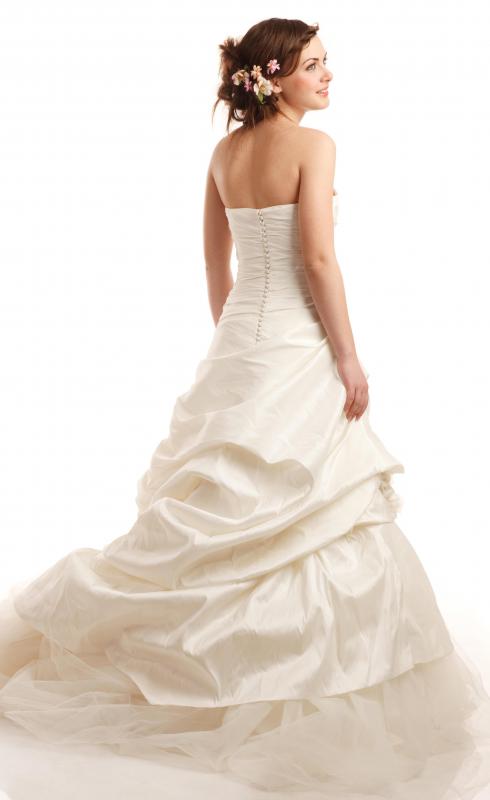 Budget-minded brides can find beautiful wedding dresses at a consignment shop.