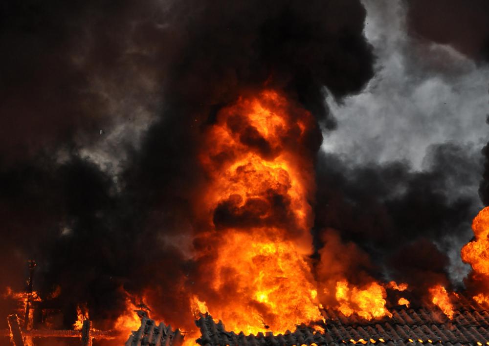Business owners with too much debt might commit insurance fraud by setting their business on fire to collect insurance money.