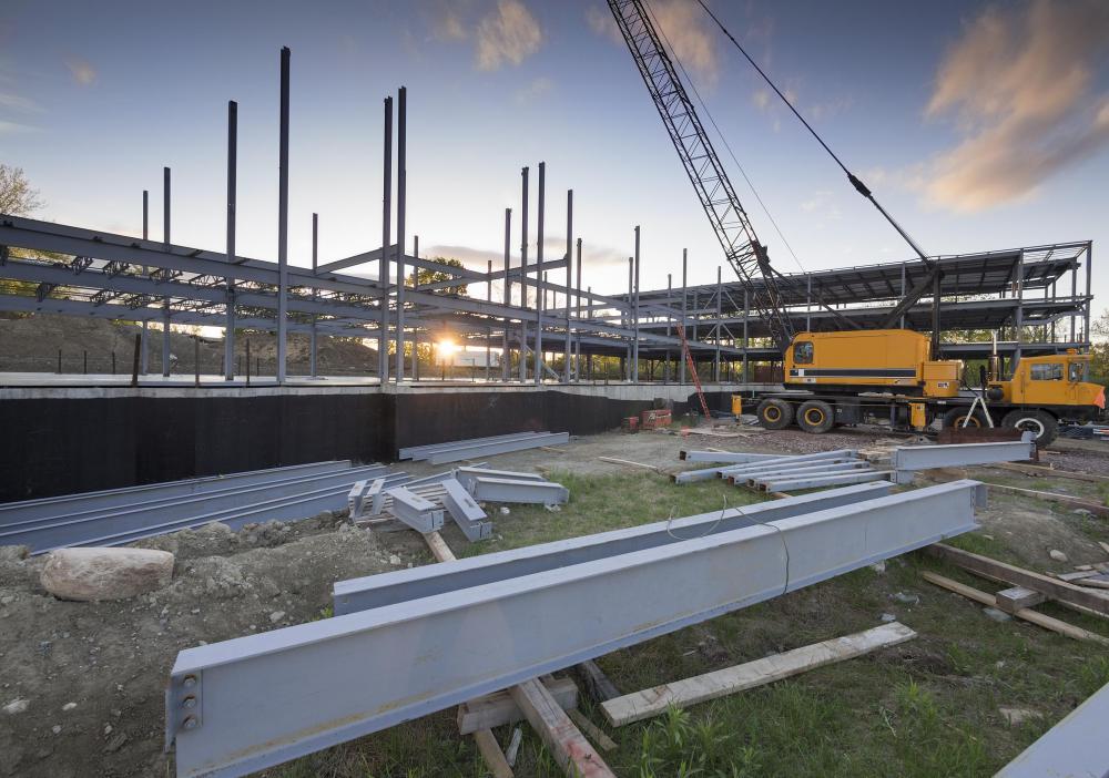 A construction bid outlines a company's qualifications and requirements, including financial considerations, to complete a project.