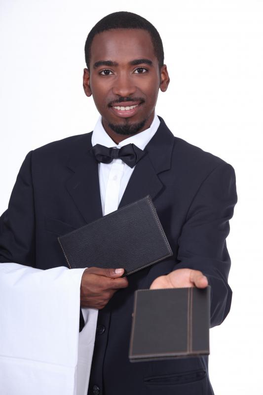 A waiter, one of the front of the house staff.