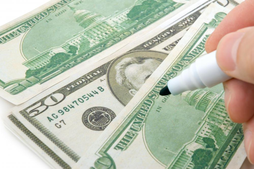 Special marking pens can detect fake bills.