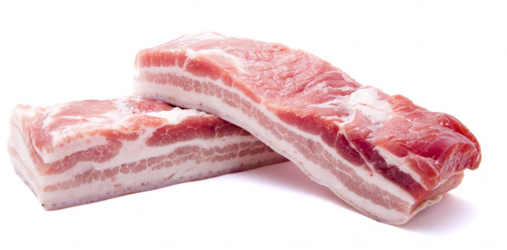 Two slabs of raw pork belly.