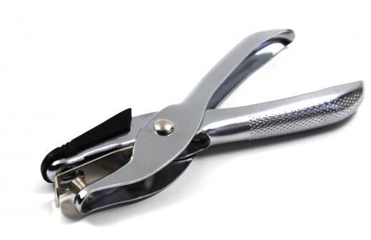 Hole punches are used as part of an office organization system.