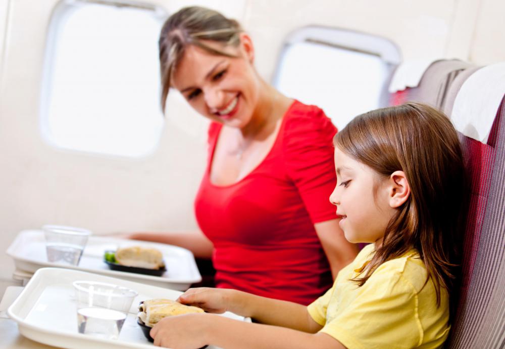 A flight attendant's duties often include serving food and drinks to passengers.