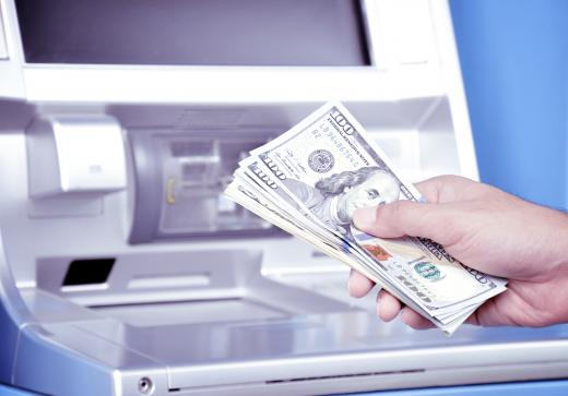 An ATM withdrawal from a checking account may immediately reduce a person's available balance.