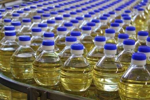 Food products with consistent demand, like cooking oils, are prepared in facilities that use automated repetitive manufacturing processes.