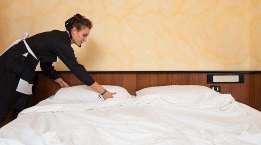 A hotel back office manager oversees the housekeeping staff.